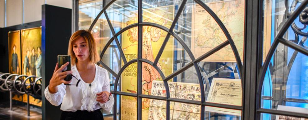 Woman in museum recording herself